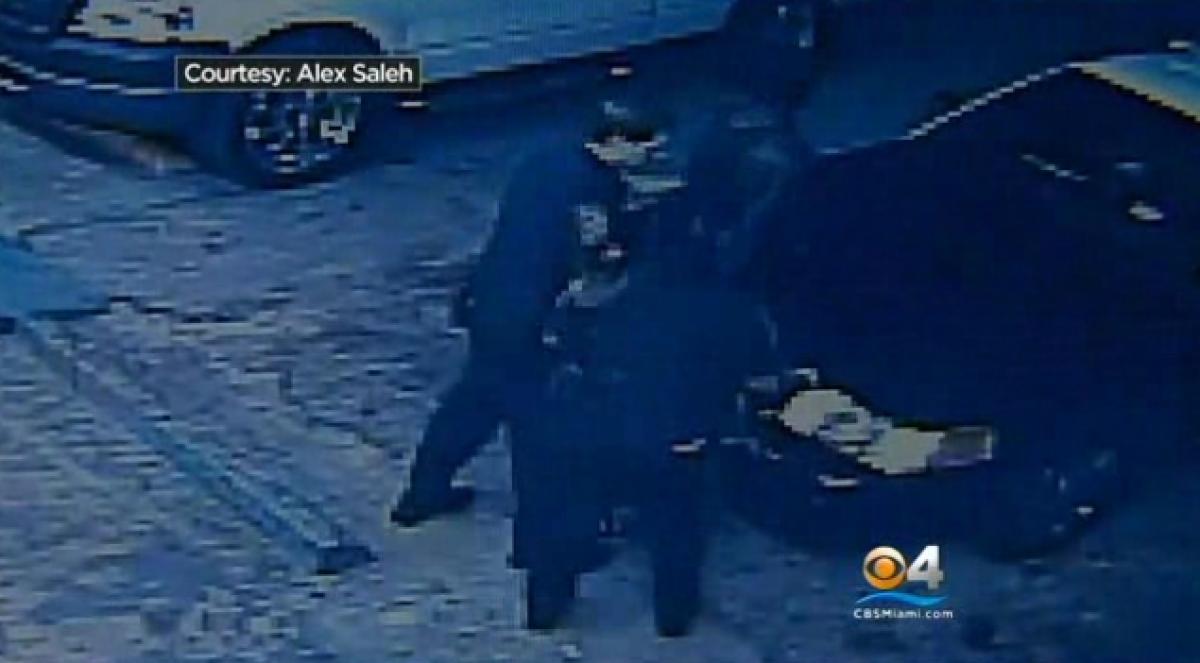  Store surveillance video since set up by the owner of the Miami Gardens convenience store shows Sampson being stopped by police after simply exiting the store. (Courtesy Alex Saleh/CBS Miami) 