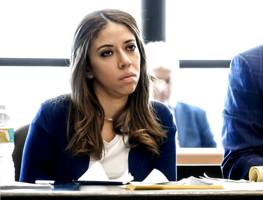 In this June 16, 2017 file photo, Dalia Dippolito listens to attorneys and Circuit Judge Glenn Kelley discuss jury instructions in her third attempted murder trial in West Palm Beach, Fla. Circuit Judge Glenn Kelley is scheduled Friday, July 21 to sentence Dippolito, who was convicted last month of solicitation of first-degree murder. She was recorded on video and audio in 2009 as she plotted to kill Michael Dippolito, telling an undercover detective she was "5,000 percent sure" she wanted her husband dead.(Lannis Waters /Palm Beach Post via AP, Pool)